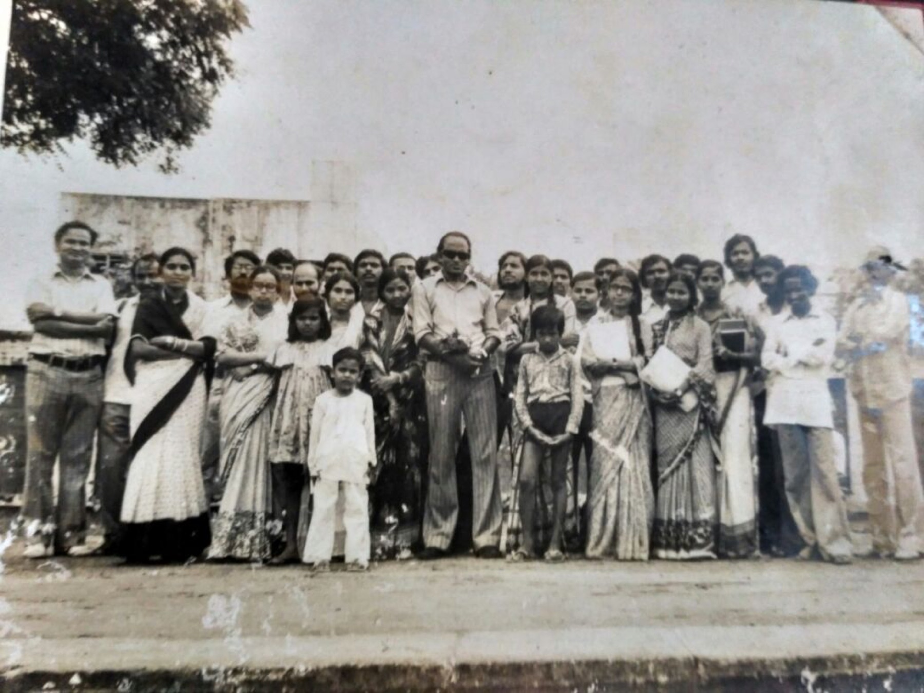 Dr. Das with students and colleagues at a departmental gathering